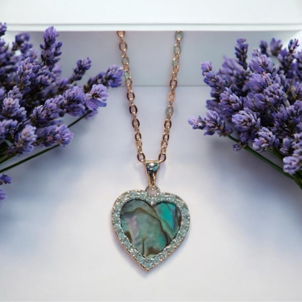 Anna Zuckerman abalone heart necklace featuring a rose gold chain